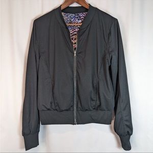 Zella Black Reversible Bomber Jacket. One side is multicolored. 2 front pockets